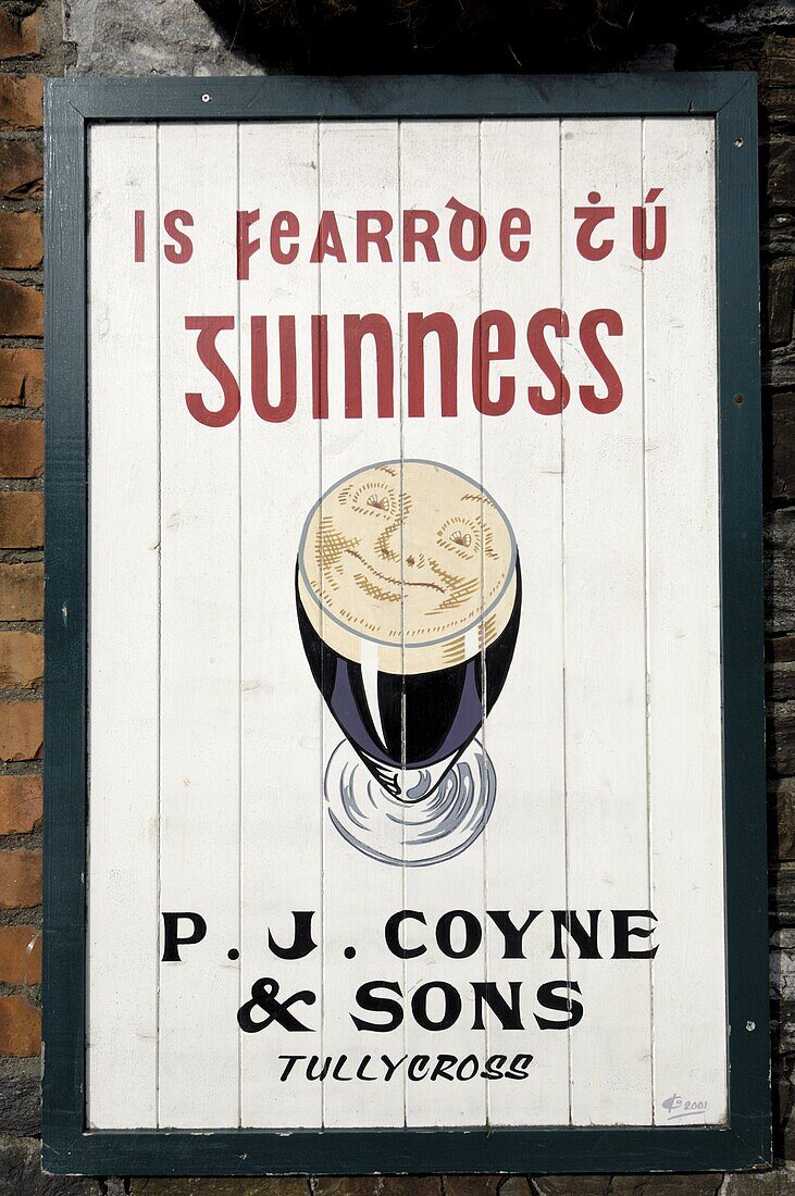 Guinness sign in Irish speaking Gaeltacht area, Tully Cross, Connemara, County Galway, Connacht, Republic of Ireland, Europe