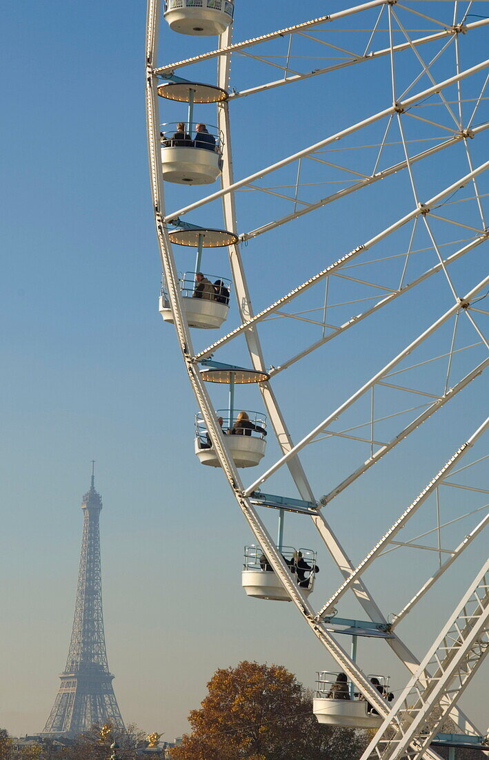 The holiday season big wheel near the Place de la Concorde with the Eiffel Tower in the background, Paris, France, Europe