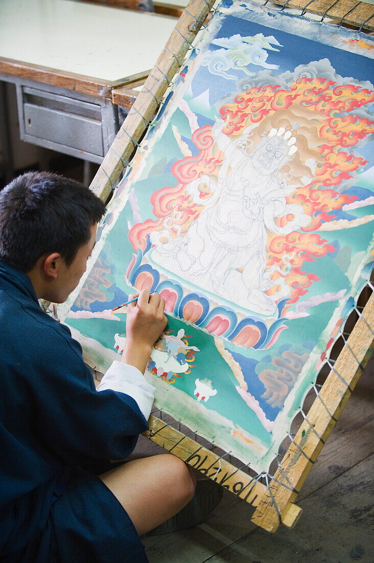 Thangka painter at the National Institute for Zorig Chusum Pedzoe, (Painting School), Thimphu, Bhutan, Asia