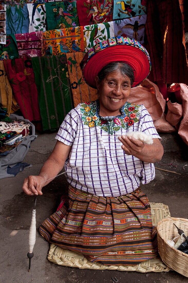 Woman spinning cotton fibers, Santiago Atitlan, Lake Atitlan, Guatemala, Central America