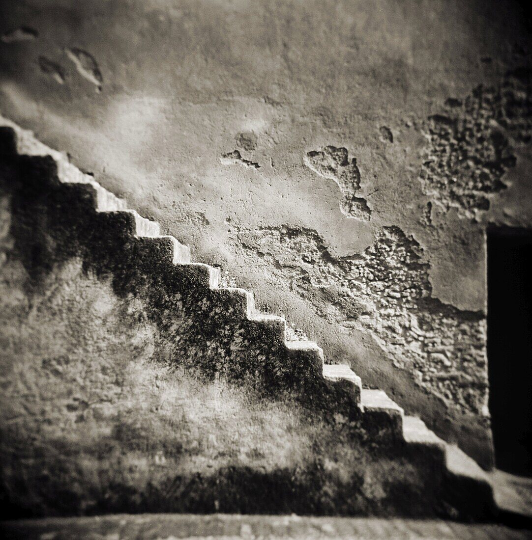 Image taken with a Holga medium format 120 film toy camera of a staircase on the outside of an old stone wall, Chefchaouen, Morocco, North Africa, Africa