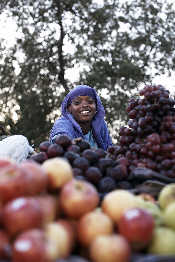 A girl selling fruit in the European Quarter of Djibouti City, Djibouti, Africa