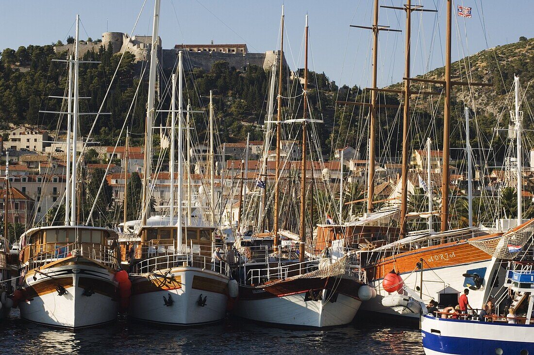 Harbour area and Venetian fortress dating from 1551 on the hill, Hvar Island, Dalmatia, Croatia, Europe