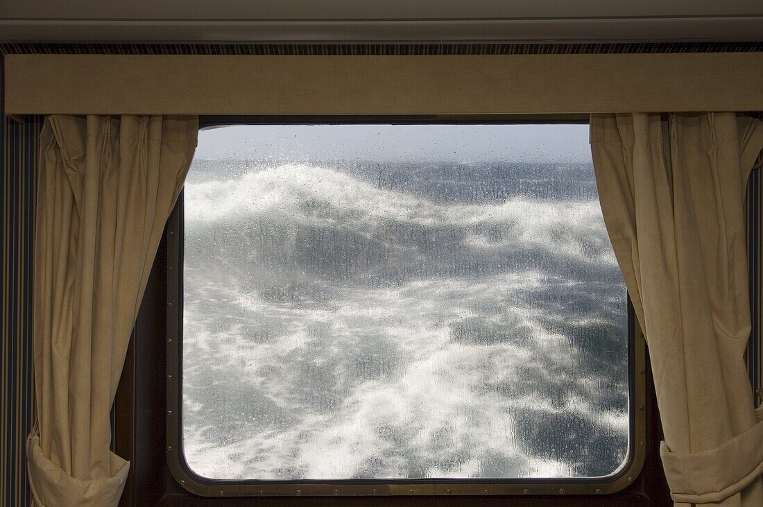 View from cabin on Antarctic Dream navigation on rough seas near Cape Horn, Drake Passage, Antarctic Ocean, Tierra del Fuego, Patagonia, Chile, South America