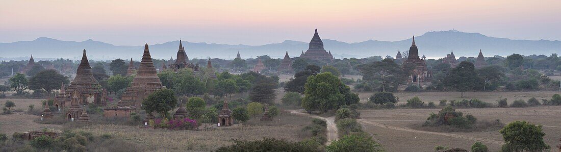 Panoramic view at dusk over the plain and temples of Bagan from Shwesandaw Paya, Bagan Central Plain, Myanmar (Burma)