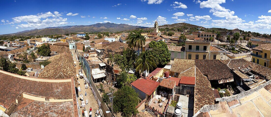 Panoramic view over the pantiled rooftops and cobbled streets of the town towards the belltower of The Convento de San Francisco de Asis, Trinidad, UNESCO World Heritage Site, Cuba, West Indies, Central America