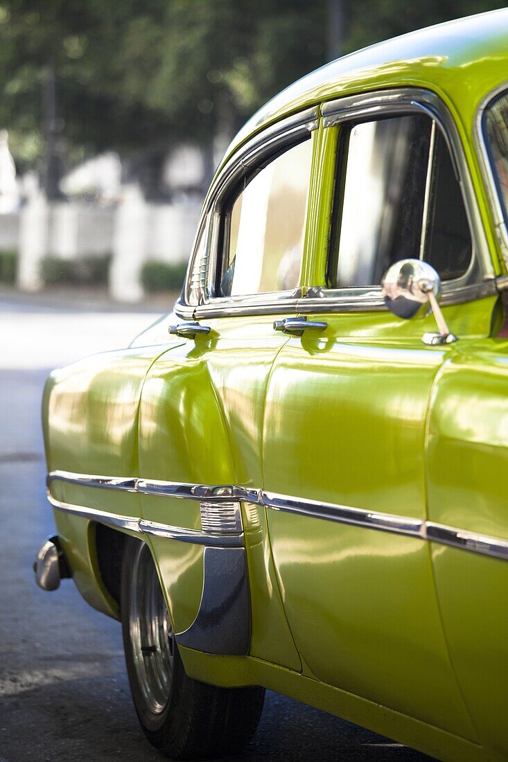 Green vintage American car parked on a street in Havana Centro, Havana, Cuba, West Indies, Central America