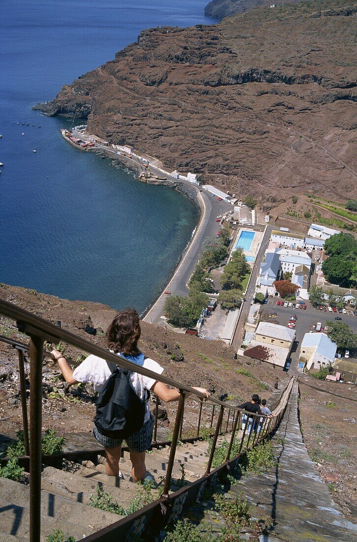 Tourists walking down flight of steps called Jacobs Ladder, towards the harbour at Jamestown, St. Helena, Atlantic Ocean, Mid Atlantic