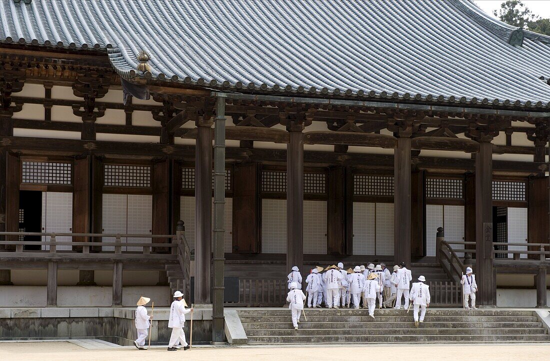 Pilgrims visiting the Buddhist Kondo Temple at the Dai Garan area of Mount Koya, Wakayama, Japan, Asia