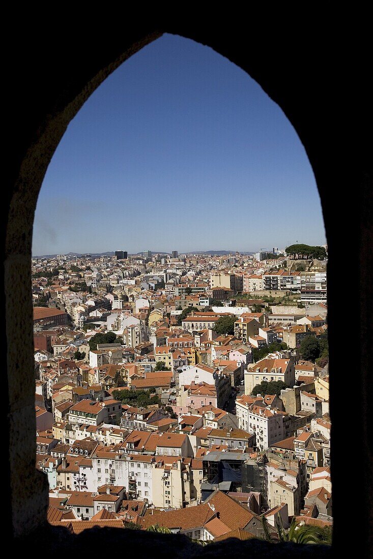 An arched window at the Castelo Sao Jorge (Castle of St. George) provides a view of Lisbon, Portugal, Europe