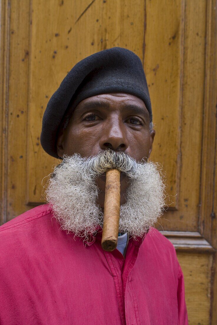 Revolutionary man smoking a cigar, Havana, Cuba, West Indies, Caribbean, Central America