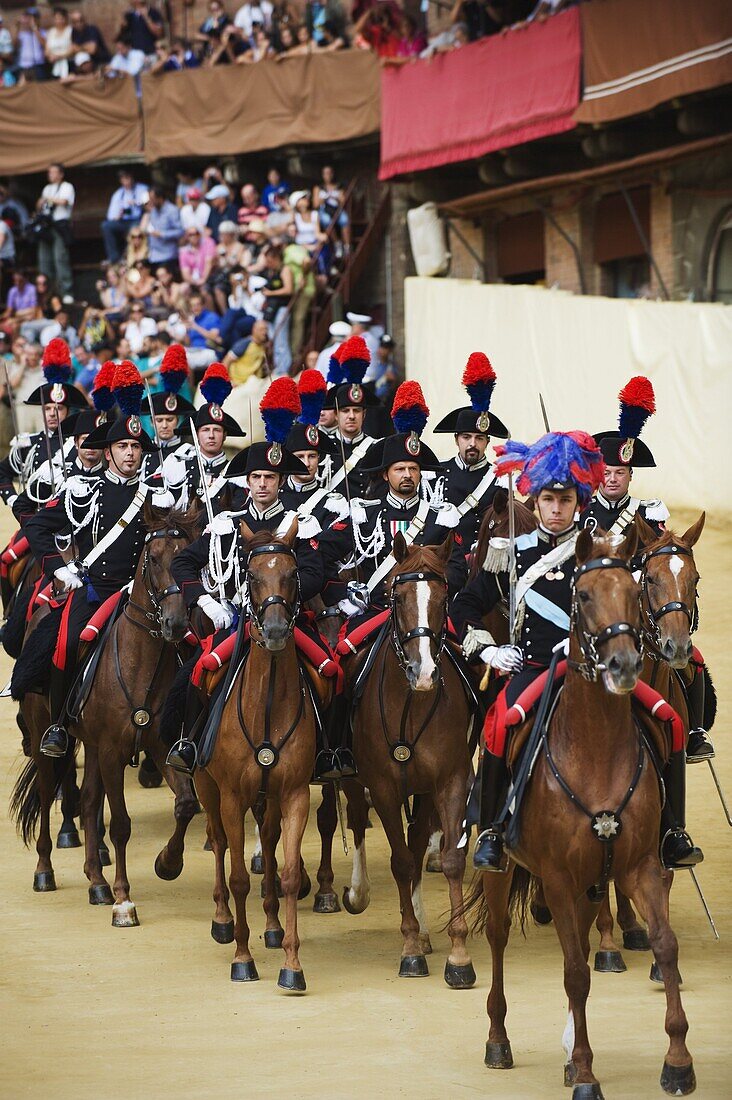 Horses and guards parading at El Palio horse race festival, Piazza del Campo, Siena, Tuscany, Italy, Europe