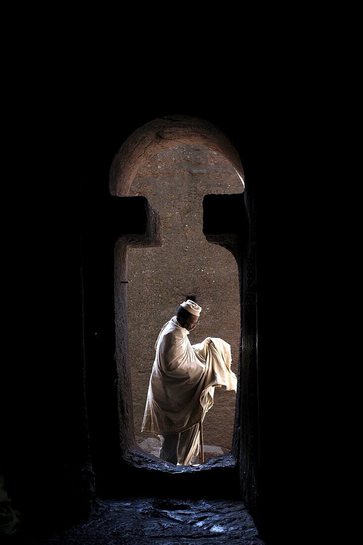 Man entering Bet Medhane Alem church in Lalibela, Wollo, Ethiopia, Africa