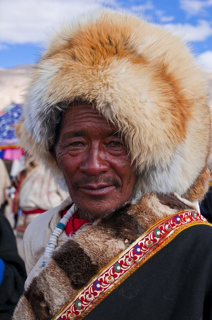 Man in traditional dress at festival, Gerze, Tibet, China, Asia