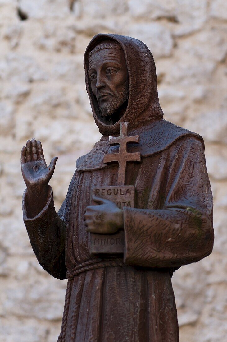 Statue of St. Francis, cloister, Franciscan Sanctuary of Fonte Colombo, Rieti, Lazio (Latium), Italy, Europe