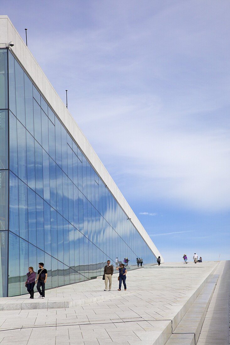 Visitors walking outside the Oslo Opera house exterior in summer sunshine, city centre, Oslo, Norway, Scandinavia, Europe