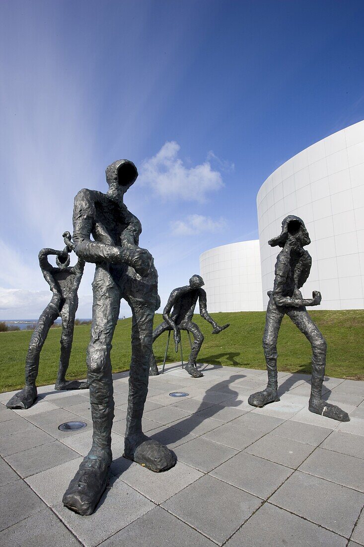 Modern sculpture of four figures playing imaginary musical instruments, outside Perlan, Reykjavik, Iceland, Polar Regions