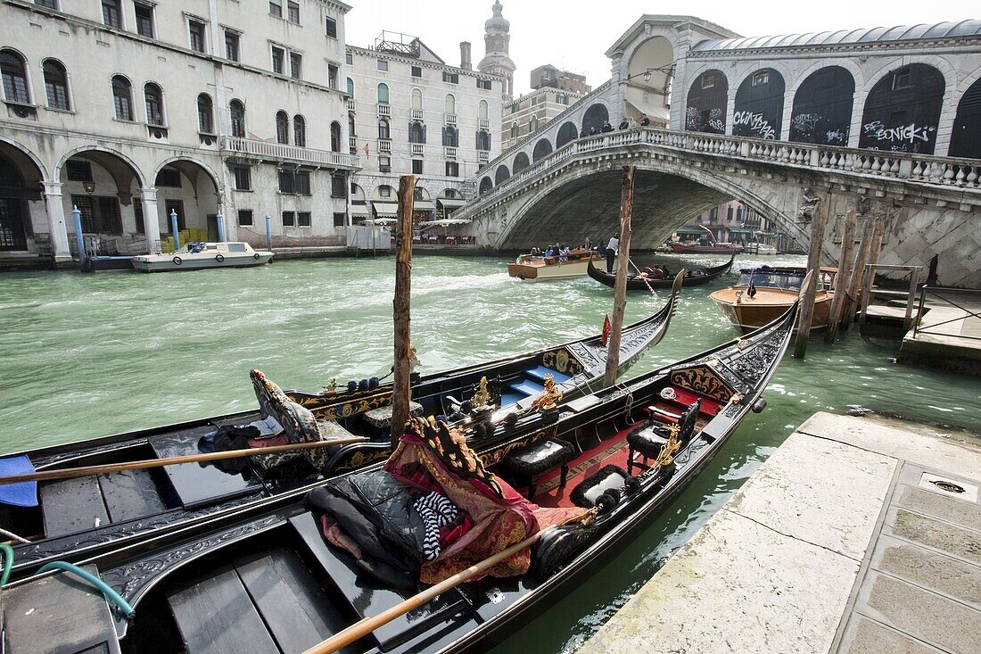 Gondolas moored by Rialto Bridge, Venice, UNESCO World Heritage Site, Veneto, Italy, Europe