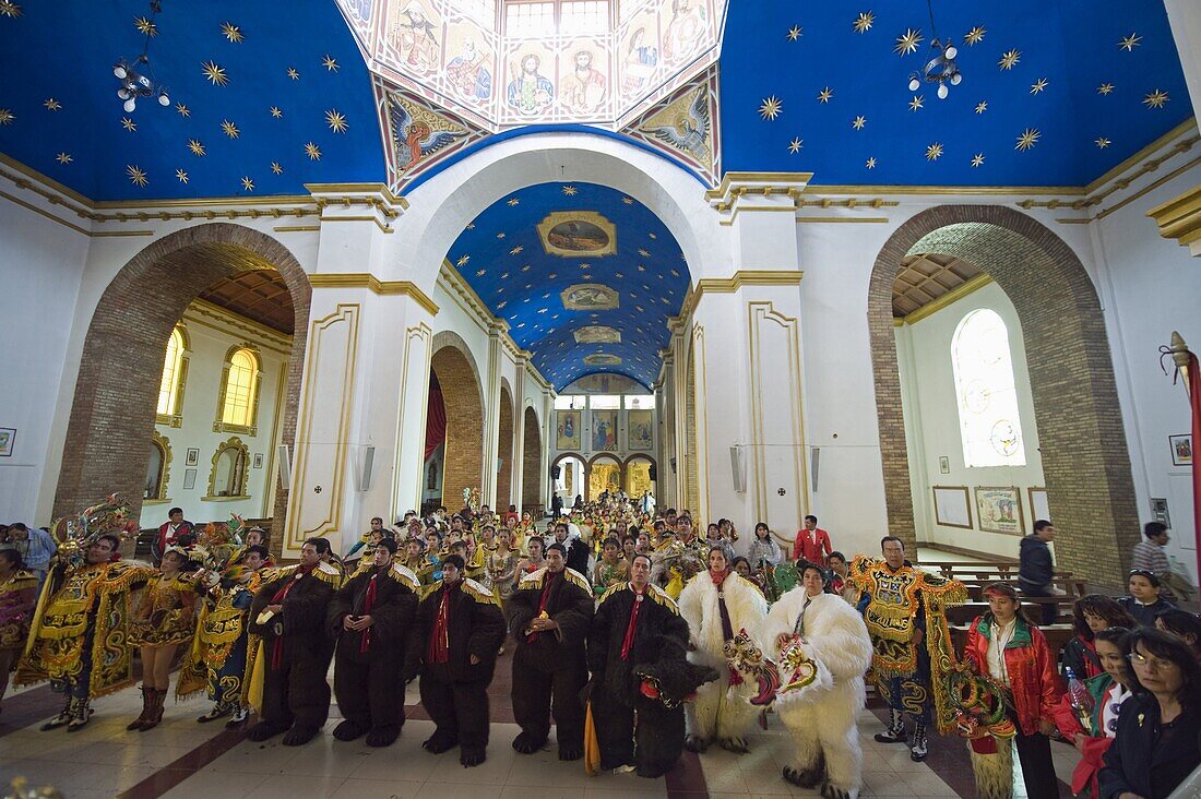 Procession continuing inside church at the Oruro Carnival, Oruro, Bolivia, South America