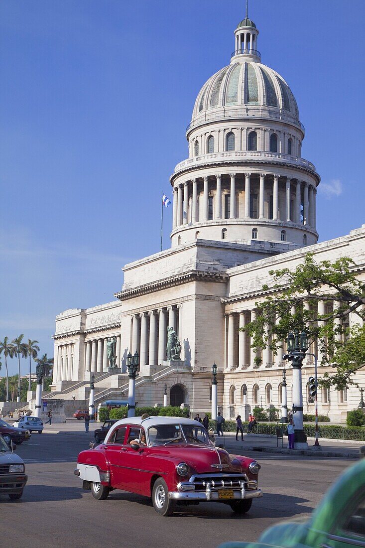 Traditonal old American cars passing the Capitolio building, Havana, Cuba, West Indies, Caribbean, Central America