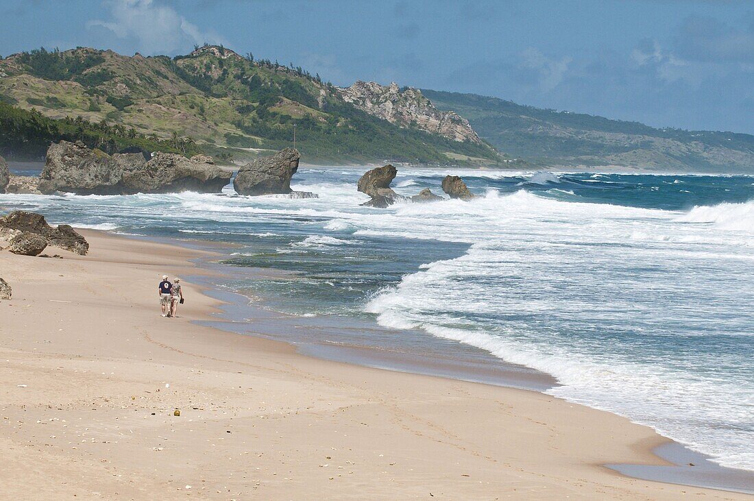 Mature couple walking on Bathsheba Beach, Barbados, Windward Islands, West Indies, Caribbean, Central America