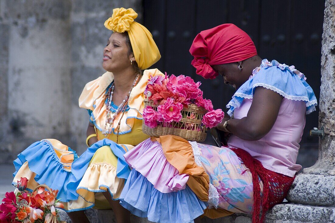 Flower girls in Plaza de la Catedral, Habana Vieja, Havana, Cuba, West Indies, Central America