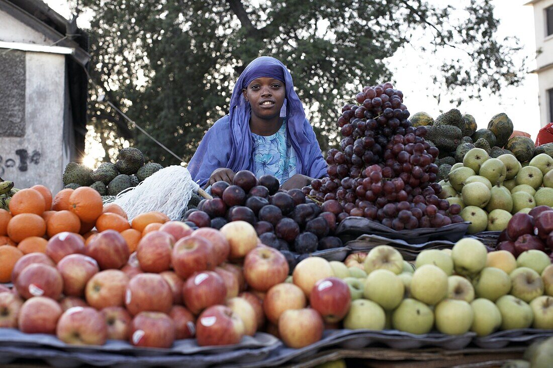 A girl selling fruit in the European Quarter of Djibouti City, Djibouti, Africa