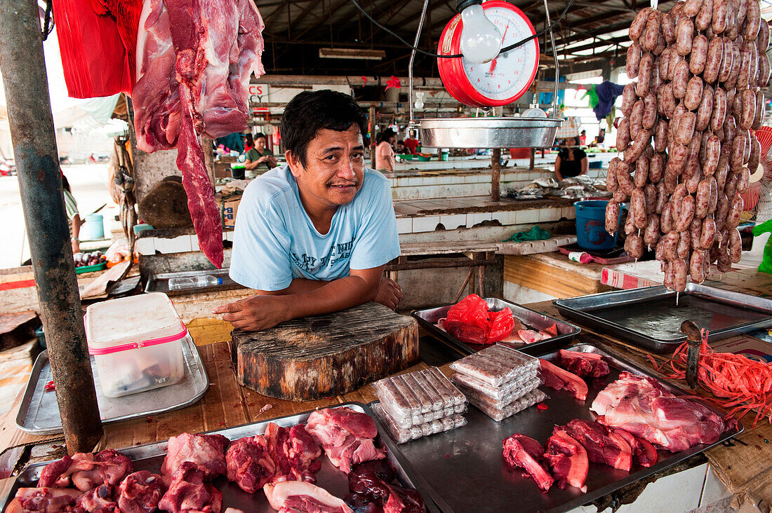 Butcher at market, Coron, Busuanga, Palawan, Philippines, Asia