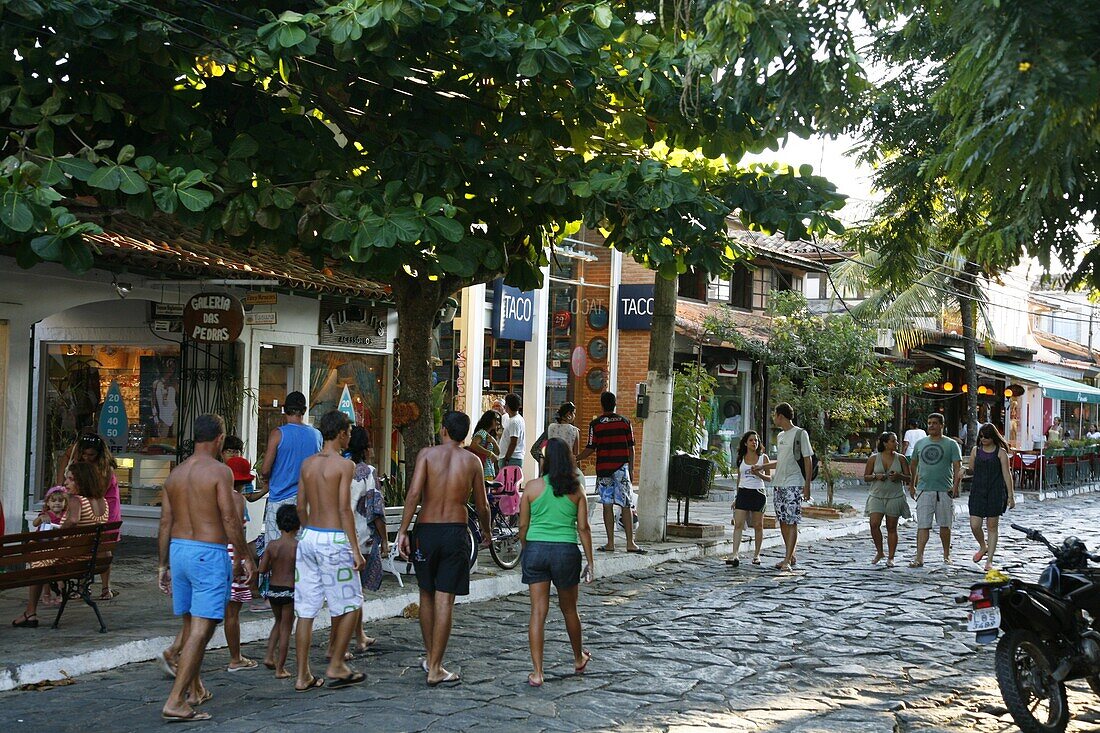 People walking on Rua das Pedras dotted with restaurants and boutiques, Buzios, Rio de Janeiro State, Brazil, South America