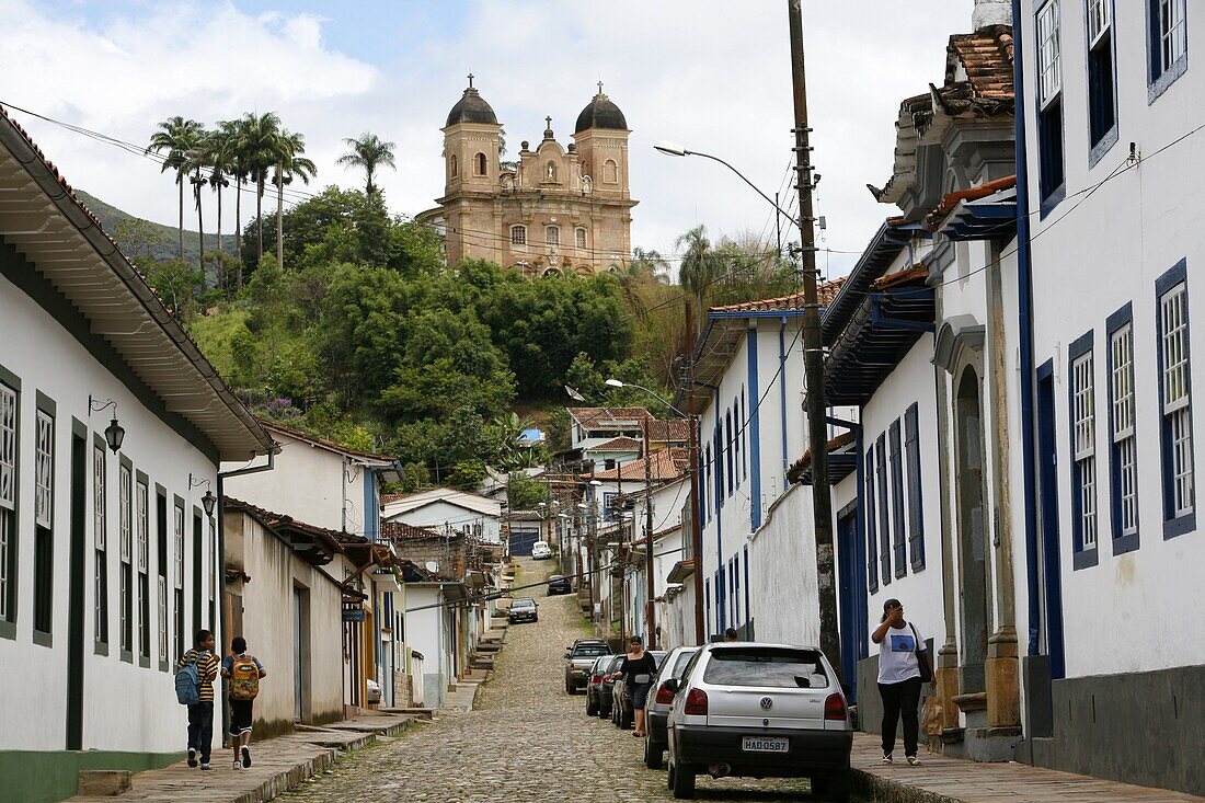 Street scene with the Basilica de Sao Pedro dos Clerigos at the end, Mariana, Minas Gerais, Brazil, South America