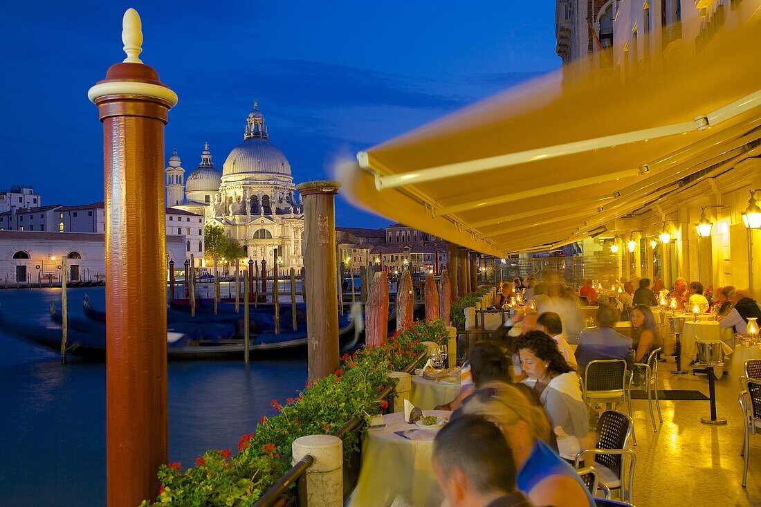 Santa Maria della Salute and restaurant at dusk, Dorsoduro, Venice, UNESCO World Heritage Site, Veneto, Italy, Europe