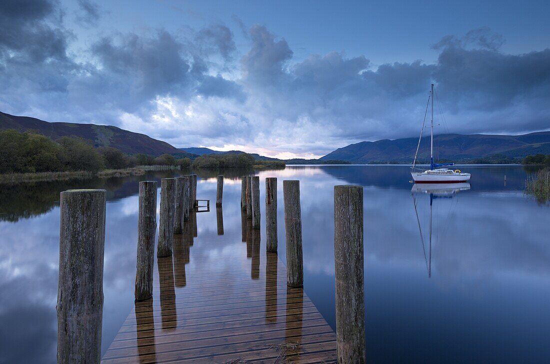 Wooden jetty and yacht on Derwent Water near Lodore, Lake District National Park, Cumbria, England, Great Britain, United Kingdom, Europe