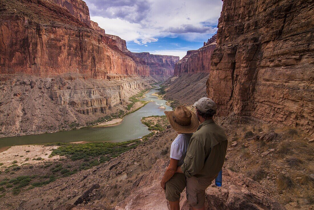 Tourists at the Nankoweap Viewpoint admiring the scenery, seen while rafting down the Colorado River, Grand Canyon, Arizona, United States of America, North America