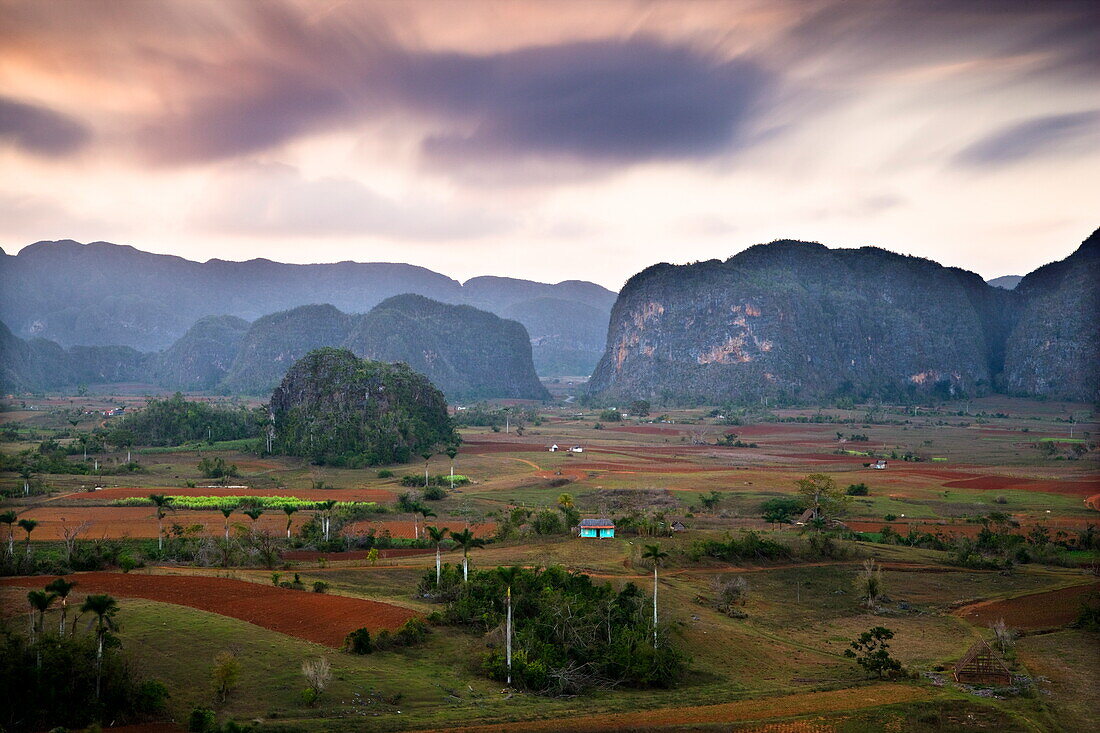 Dusk view across Vinales Valley showing limestone hills known as Mogotes, Vinales, UNESCO World Heritage Site, Cuba, West Indies, Central America
