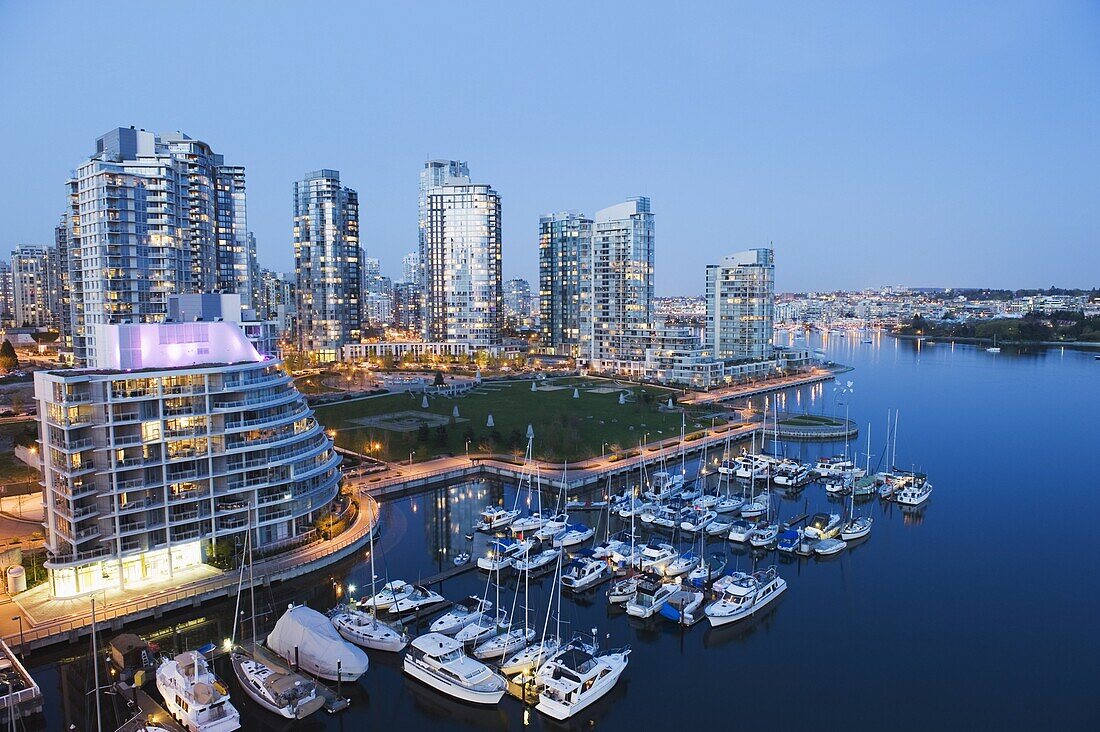 Boats moored on the waterfront in False Creek Harbour, Vancouver, British Columbia, Canada, North America
