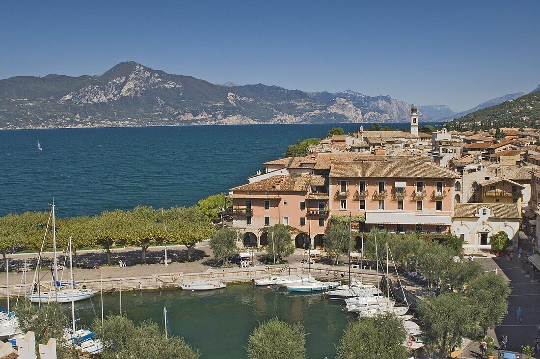 View from the castle ramparts of the harbour and town of Torre del Benaco (Torri del Benaco), Lake Garda, Veneto, Italian Lakes, Italy, Europe