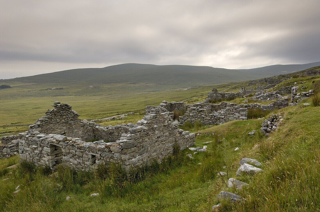 Deserted village at the base of Slievemore mountain, believed to have been abandoned during the great famine, Achill Ireland, County Mayo, Connacht, Republic of Ireland (Eire), Europe