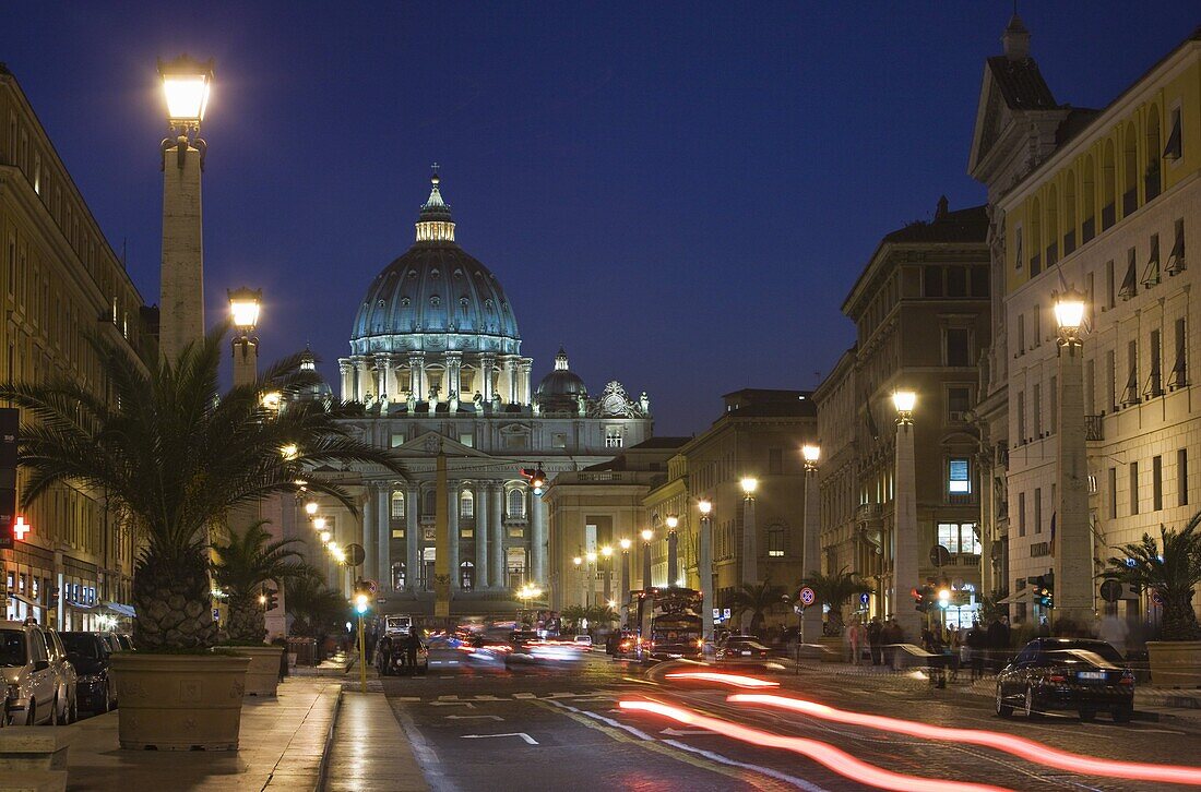 St. Peter's Basilica illuminated at night with moving traffic, Vatican City, Rome, Lazio, Italy, Europe