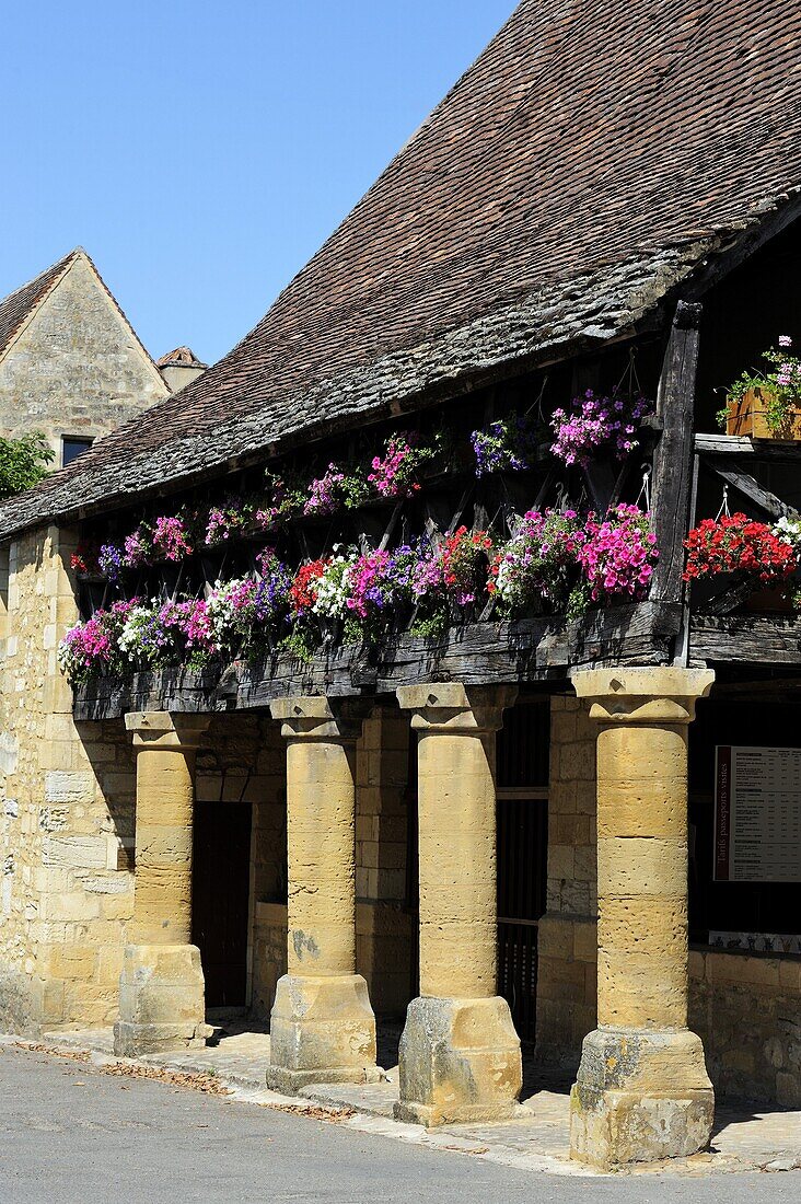 Flower bedecked medieval Les Halle, Bastide town of Domme, one of Les Plus Beaux Villages de France, Dordogne, France, Europe