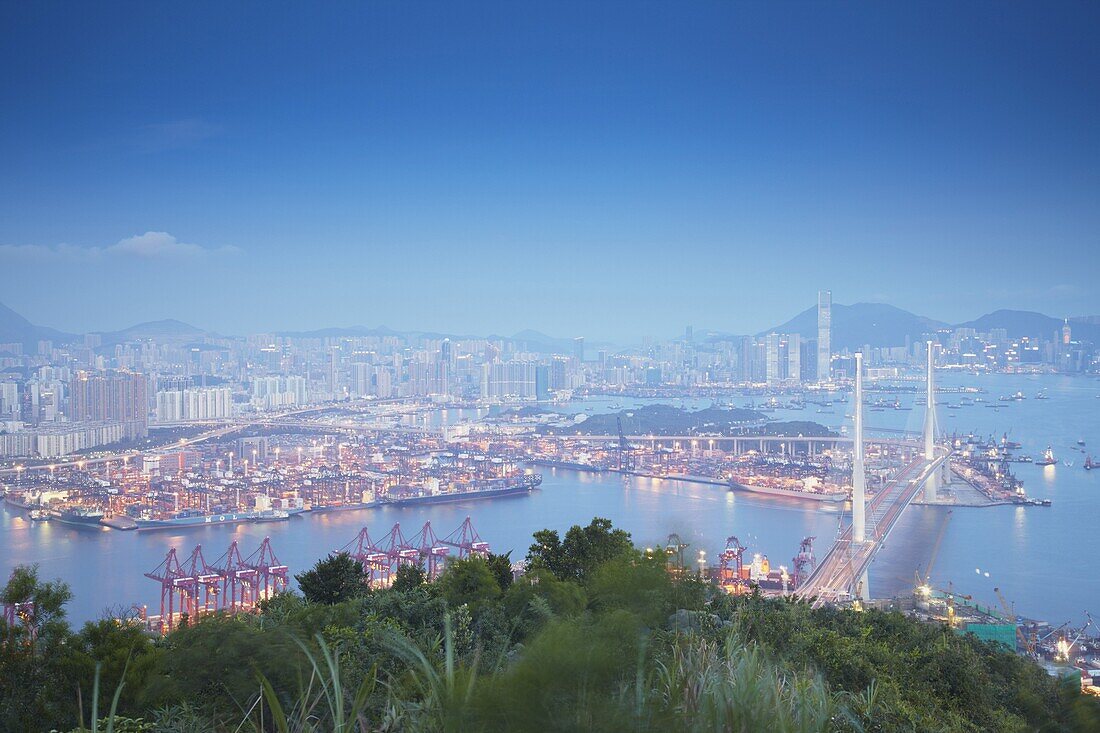 View of Stonecutters Bridge and West Kowloon from Tsing Yi at dusk, Hong Kong, China, Asia