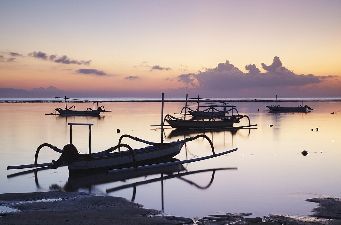 Boats on Sanur beach at dawn, Bali, Indonesia, Southeast Asia, Asia