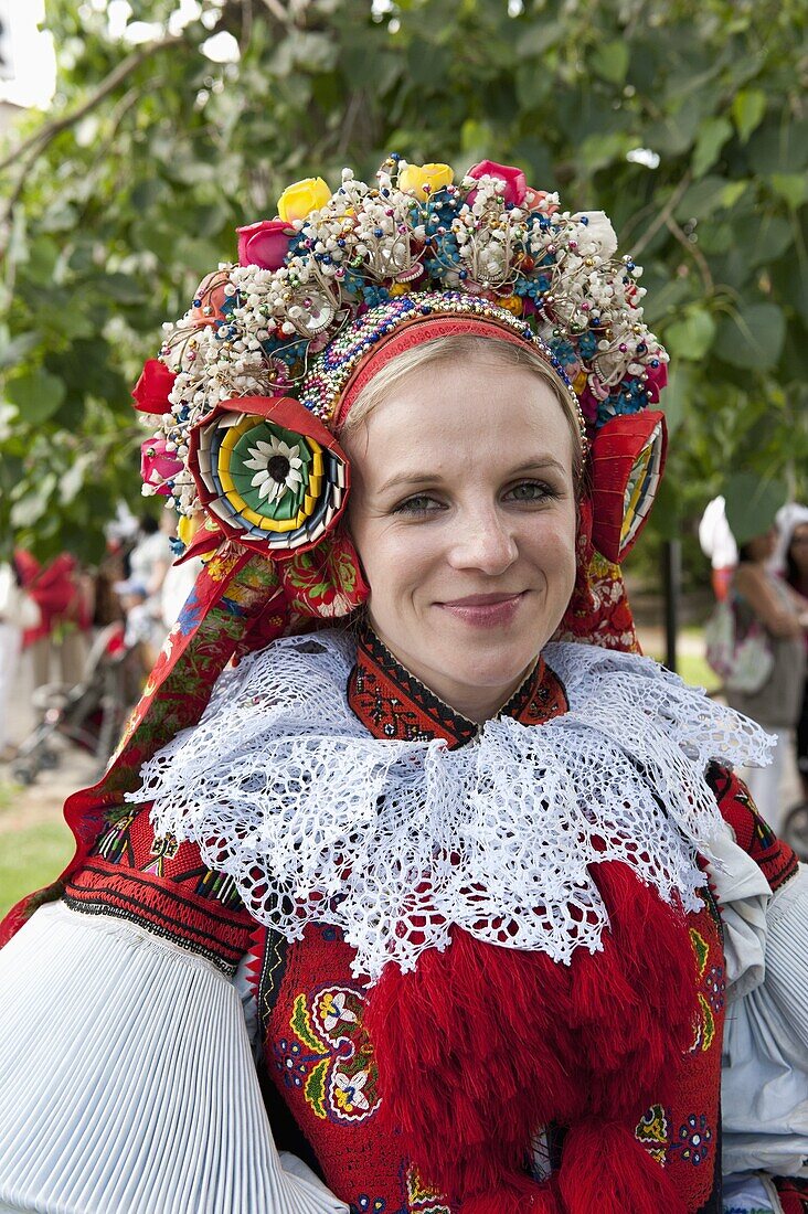 Woman wearing Vlcnov folk dress during Ride of the Kings festival, Vlcnov, Zlinsko, Czech Republic, Europe