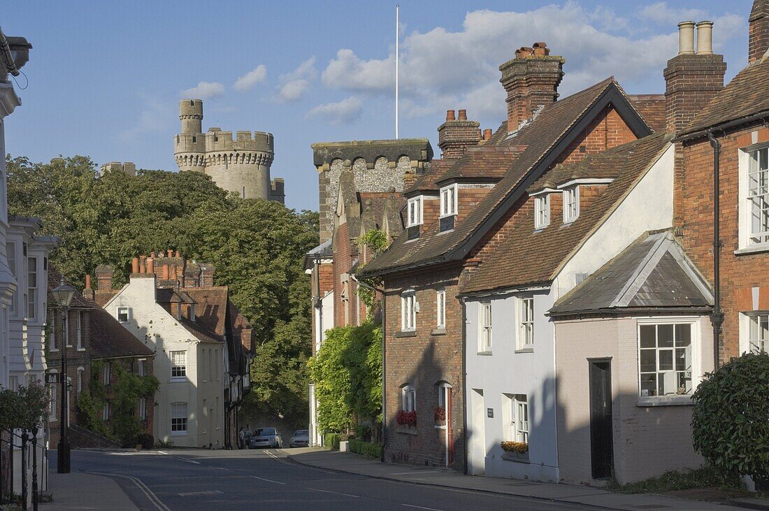 Mixed red brick dwellings approaching Arundel Castle, Arundel, West Sussex, England, United Kingdom, Europe