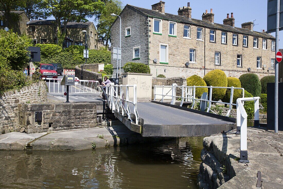 Working a Swing Bridge on the Leeds and Liverpool Canal at Skipton, North Yorkshire, Yorkshire, England, United Kingdom, Europe