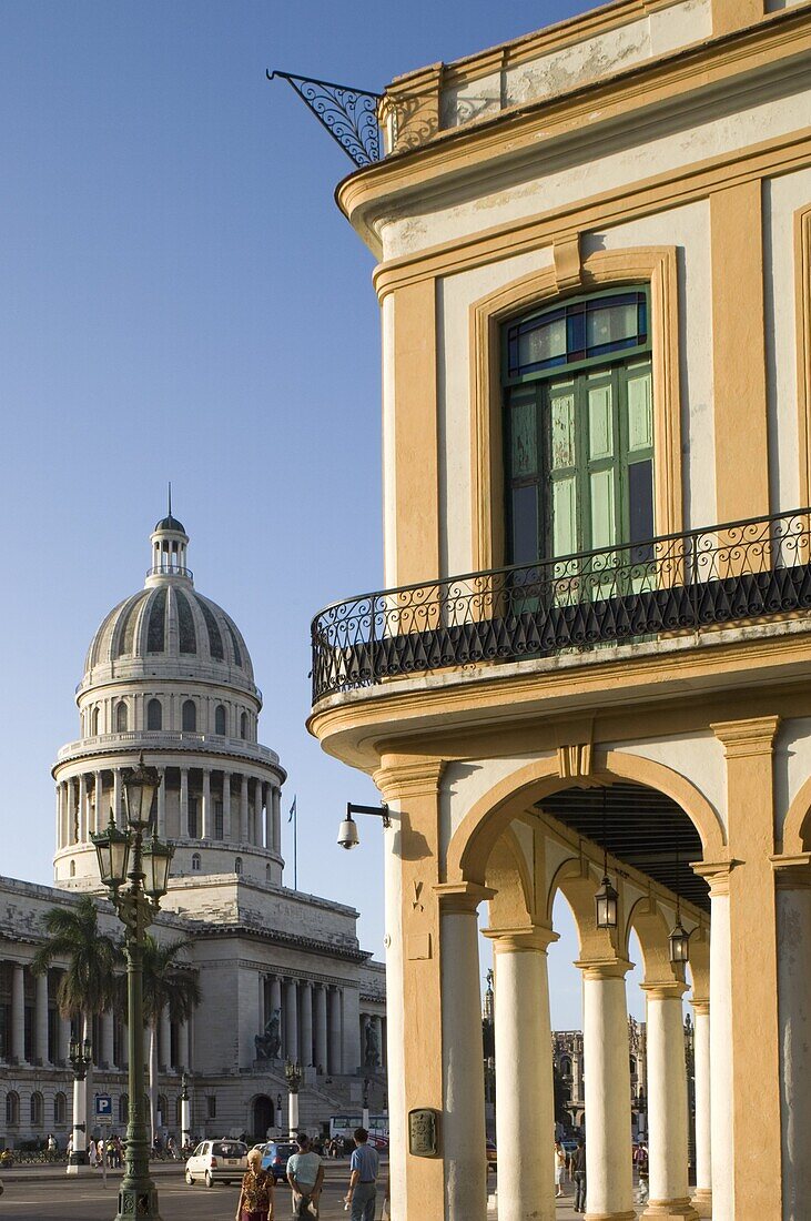 A view of the Capitolio and nearby colonial style arcade in central Havana, Cuba, West Indies, Central America