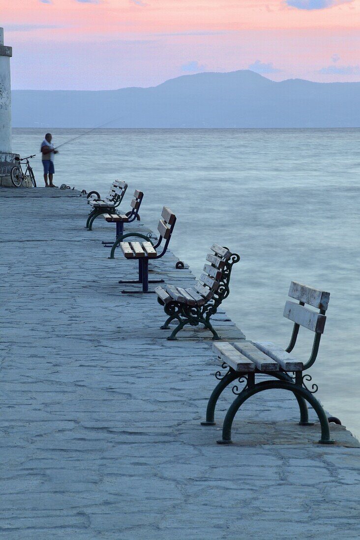 Fishing on jetty at dawn, Halkidiki, Greece, Europe