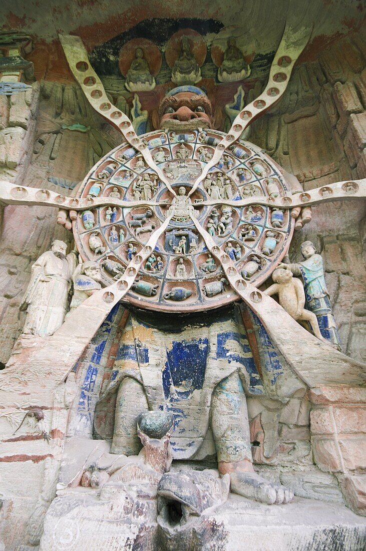 Tibetan Buddhist wheel of life rock sculpture at Dazu Rock Carvings, UNESCO World Heritage Site, Chongqing Municipality, Fujian Province, China, Asia
