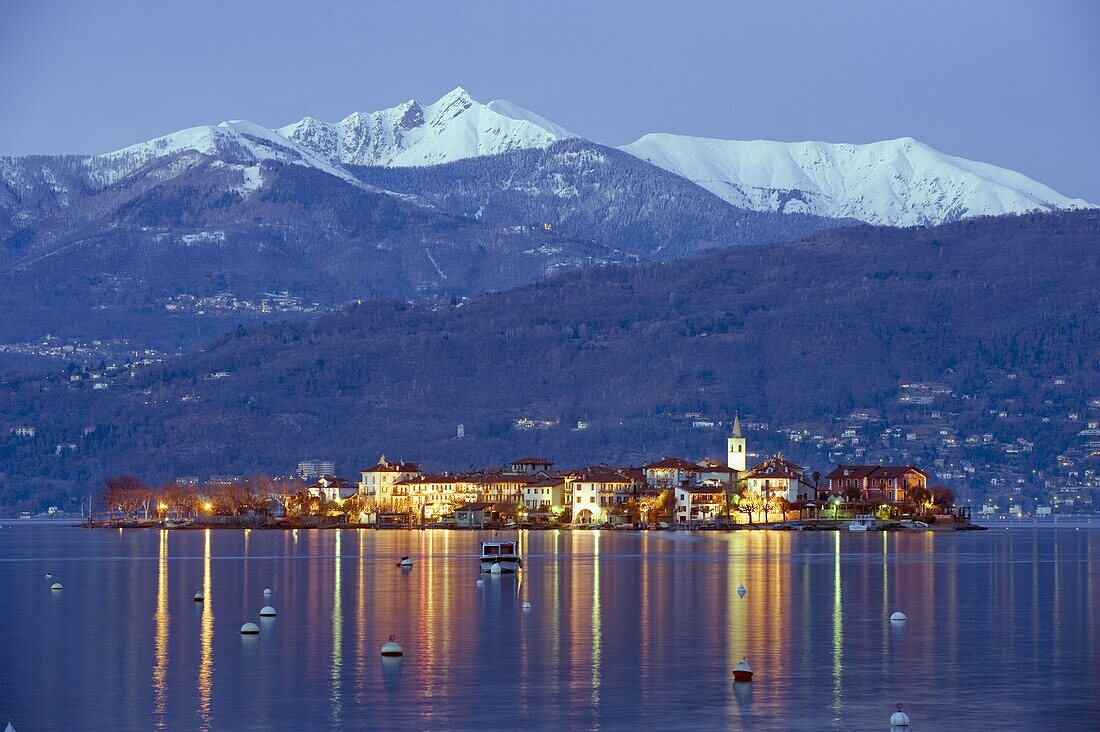 Snow capped mountains above Isola Superiore, Borromean Islands on Lake Maggiore, Italian Lakes, Piedmont, Italy, Europe