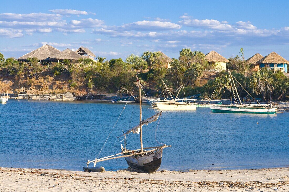 Outrigger boat lying on bank of sand, Antsanitian Beach Resort, Mahajanga, Madagascar, Indian Ocean, Africa