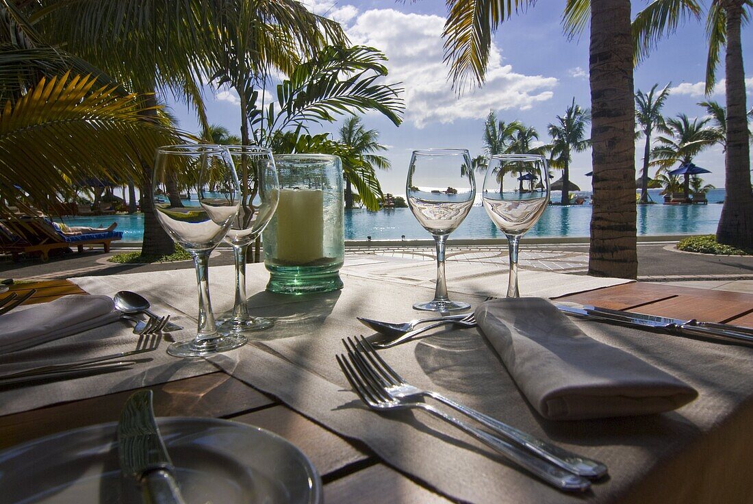 Restaurant table in front of the swimming pool of the Five star hotel Le Paradis, Mauritius, Indian Ocean, Africa